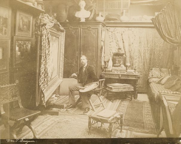 Artist Frederick Arthur Bridgman in his Paris studio, circa 1885-1890.