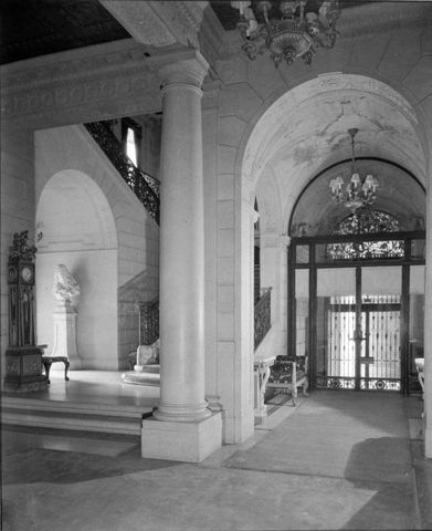 View of the East Vestibule of the Frick residence at One East 70th Street, with the house's main entrance on the right. The wrought iron grillwork on the door was commissioned from Samuel Yellin.